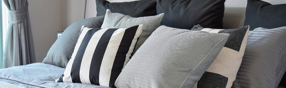 stylish-bedroom-interior-design-with-black-patterned-pillows-on